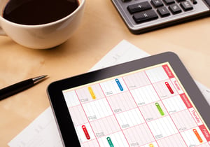 roster timetable on an ipad with coffee