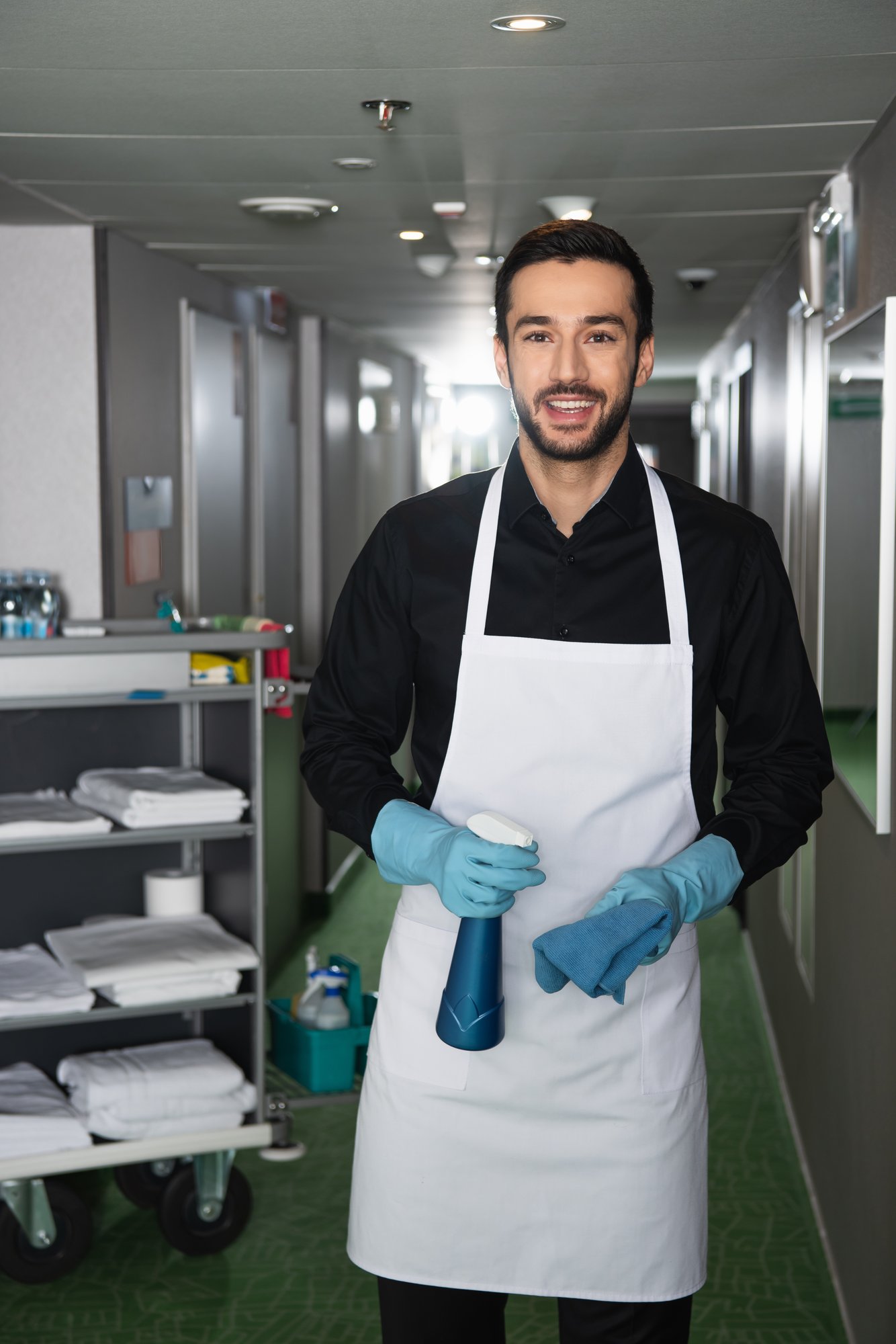 cheerful-and-bearded-housekeeper-in-rubber-gloves-2024-11-11-08-35-00-utc