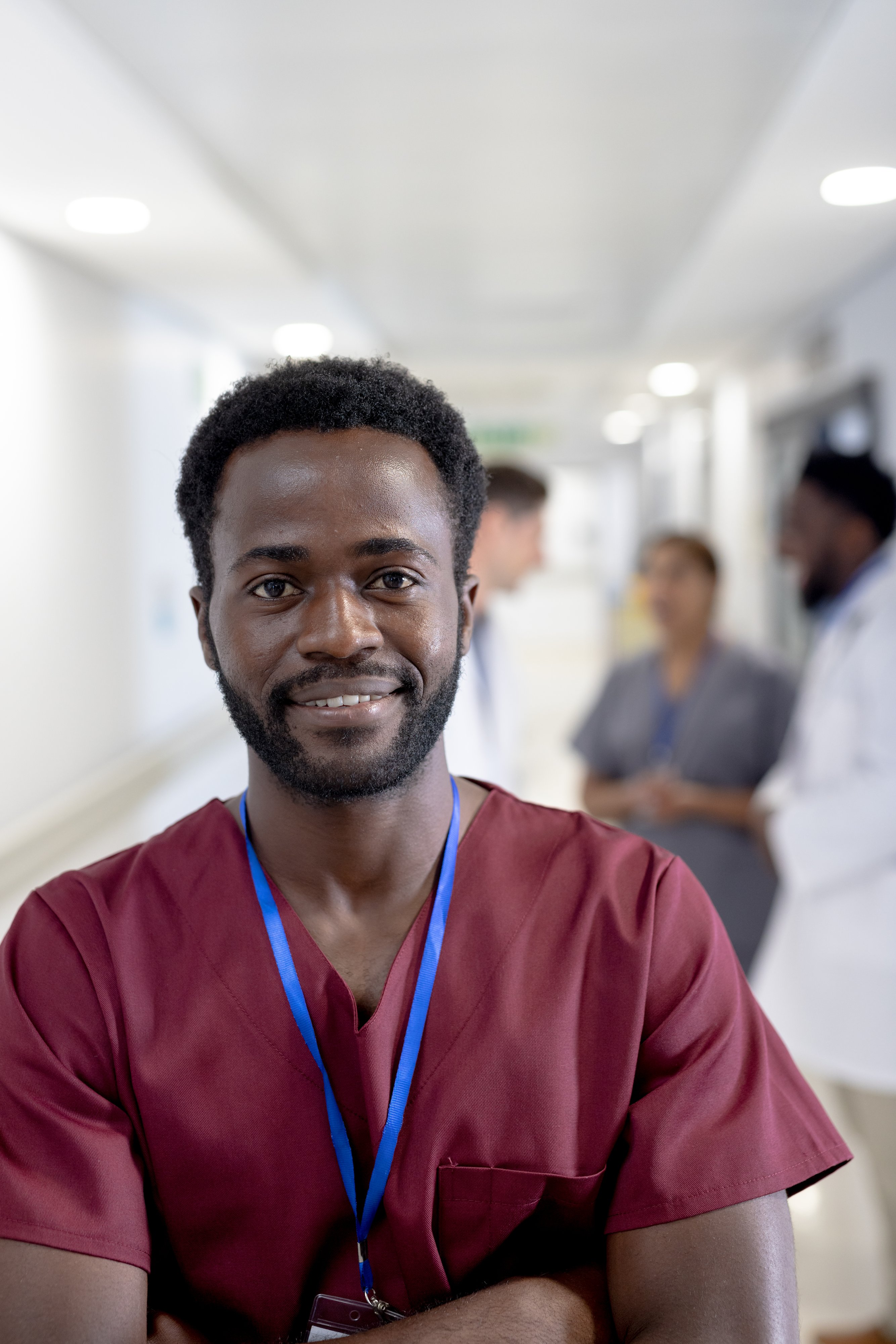 portrait-of-happy-african-american-male-doctor-wit-2023-11-27-05-33-13-utc